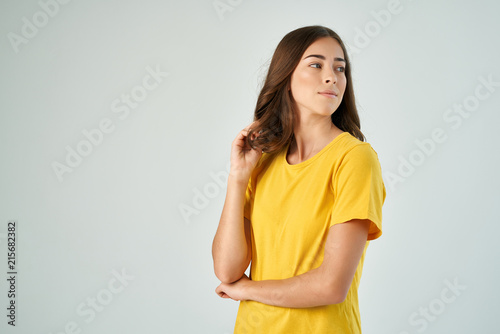 woman in a yellow T-shirt logo