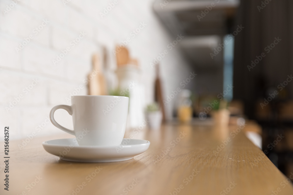 Kitchen utensils and dishware on wooden shelf. Kitchen interior background