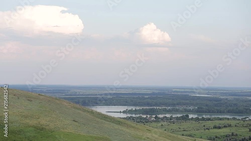 Panorama of a beautiful hill landscape, lake, river, forest, trees, and sky Russia. Life in the village