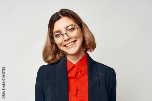business woman with glasses smiling