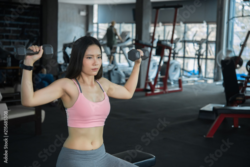 Beautiful asian woman play fitness in the gym,Thailand girl has a slim body,Time for exercise,People love heathy