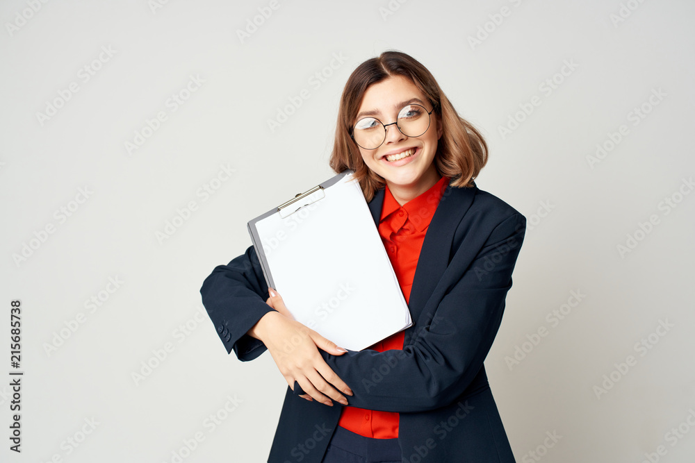 business woman with glasses smiling in the hands of documents business woman with glasses smiling in the hands of documents