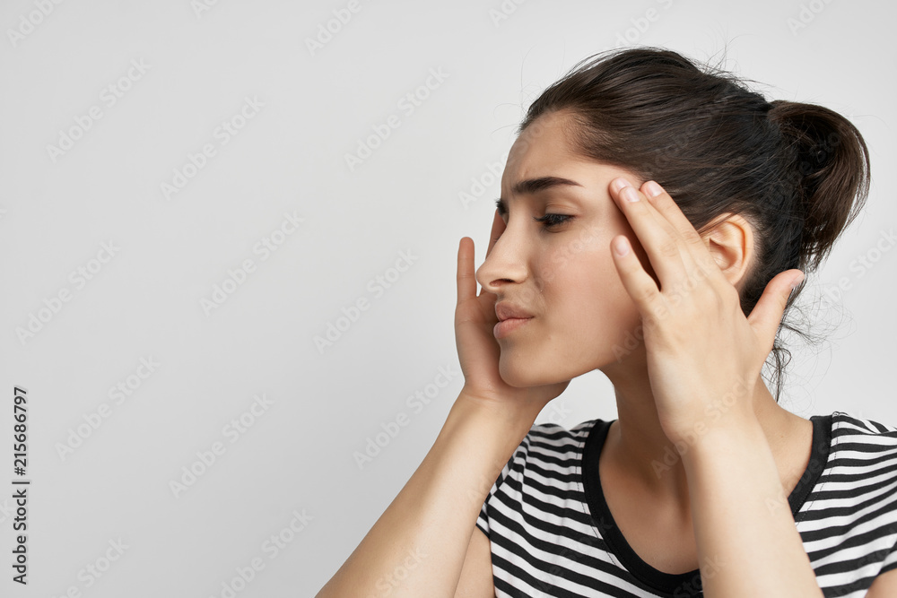 woman holding her head with eyes closed headache treatment health woman holding her head with eyes closed headache treatment health