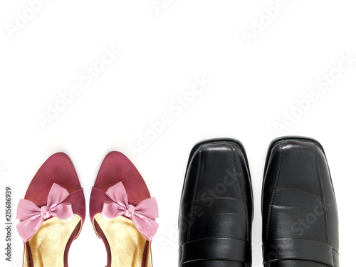 part of purple high heels shoes with pink ribbon bow and black leather shoes isolated on white background, couple standing side by side concept, flat lay close up top view with copy space for text