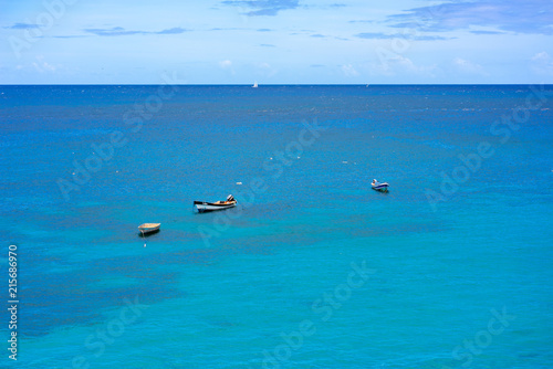 Tropical blue ocean and separated boats