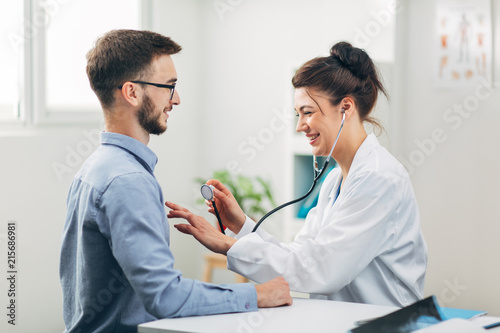 Doctor Examining Patient in Office
