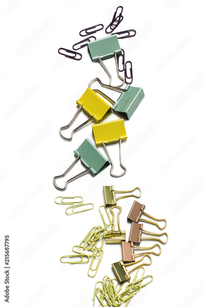 Variety of binder clips. Office supplies on white Variety of binder clips. Office supplies on white