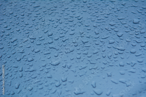 Rain drops on the car surface, Driving in rain,texture background.