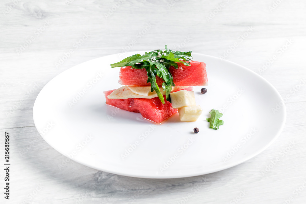 Watermelon salad with goat cheese and arugula Watermelon salad with goat cheese and arugula
