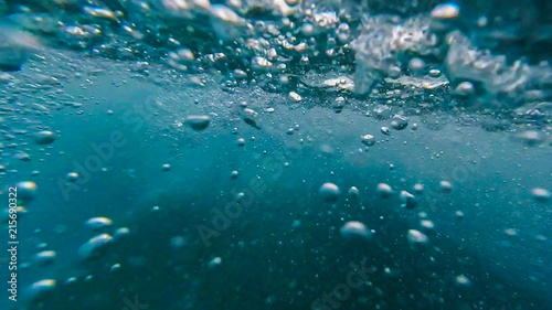 Photo under water from the pool water Park with bubbles