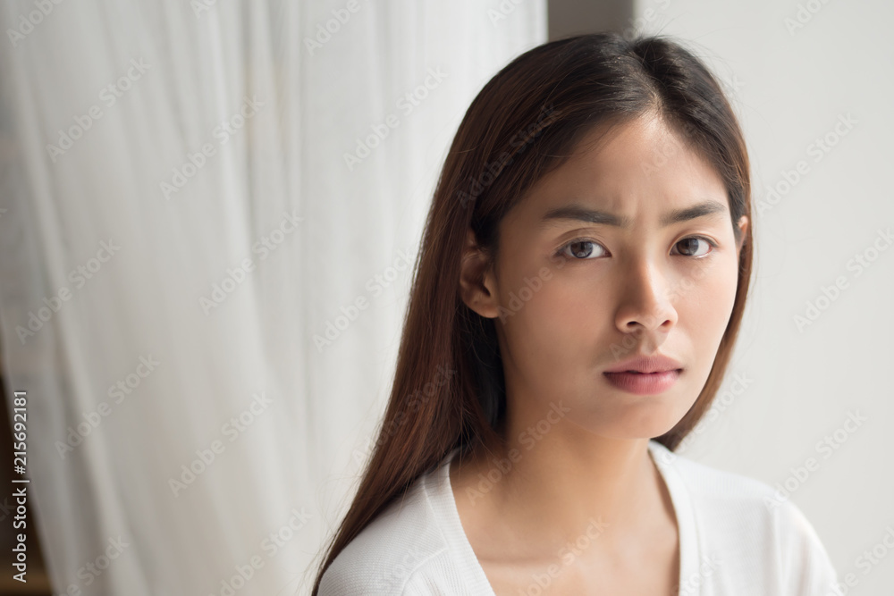 unhappy angry upset asian woman portrait with frustrated, bored, disgusted face; portrait of negative unhappy angry asian woman looking up; young adult asian persian or asian middle east woman model unhappy angry upset asian woman portrait with frustrated, bored, disgusted face; portrait of negative unhappy angry asian woman looking up; young adult asian persian or asian middle east woman model