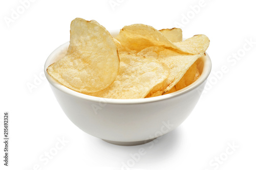 Delicious golden potato chips in a white bowl isolated on white background.