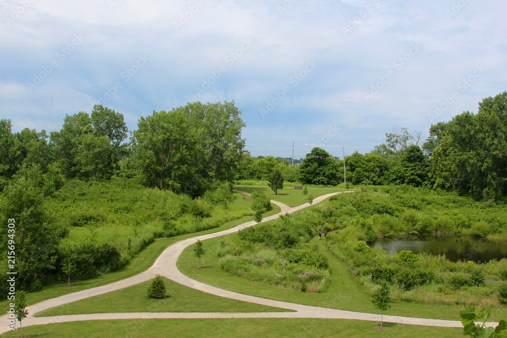 The trails and the green grass landscape of the park. The trails and the green grass landscape of the park.
