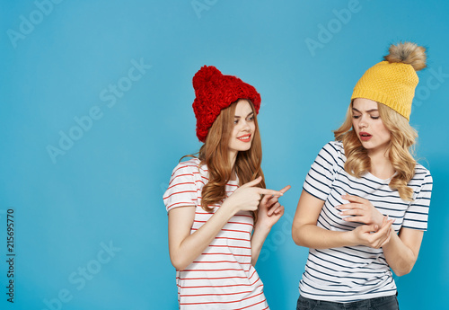girlfriends women in hats on a blue background