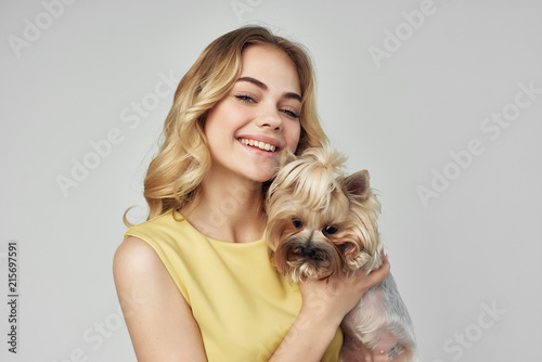 young woman with dog yorkshire terrier