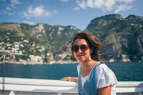 girl on a boat on a mountain background