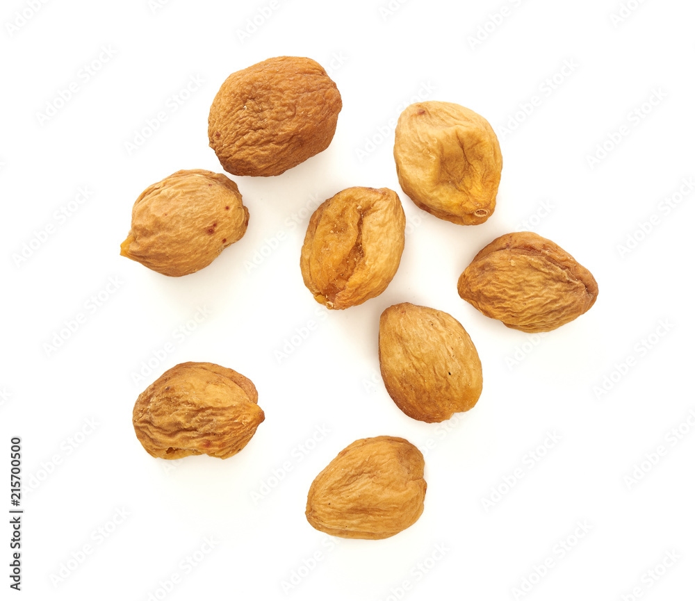 Yellow sun dried apricots isolated on white background. Top view. Yellow sun dried apricots isolated on white background. Top view.