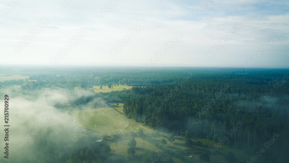 Misty sunrise over countryside path Aerial view Latvia Misty sunrise over countryside path Aerial view Latvia