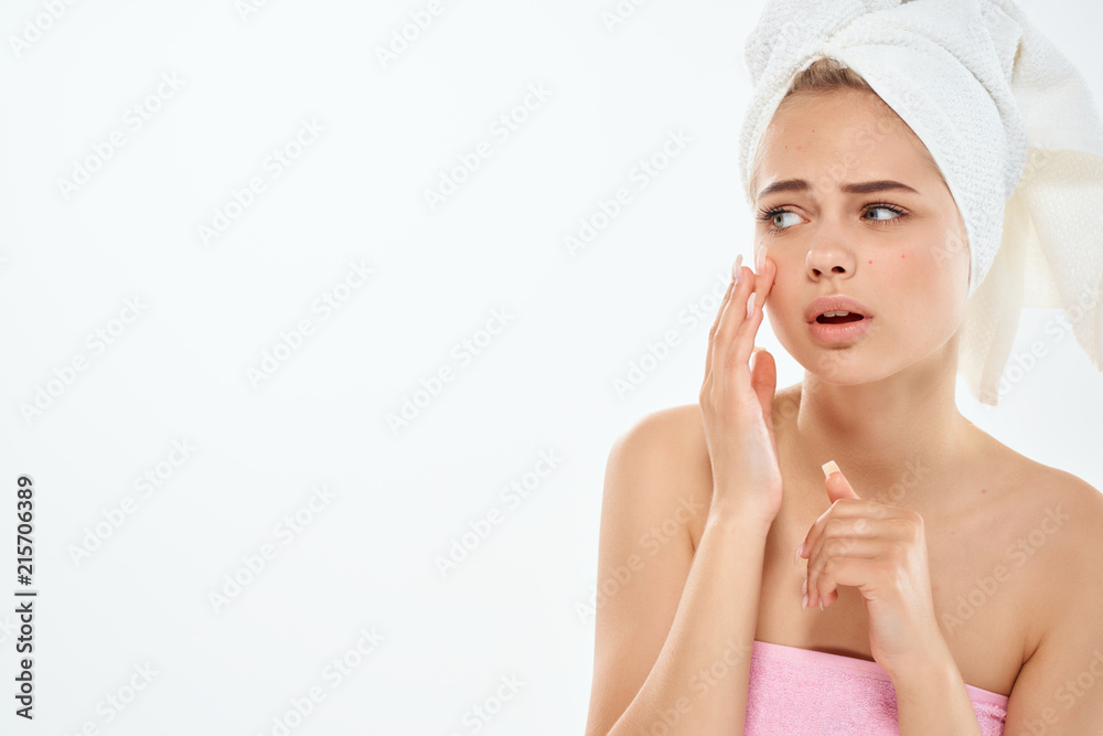 woman caring for her face woman caring for her face
