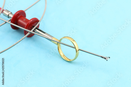 flexible endoscopy forceps, oval cup coated in a blue background 