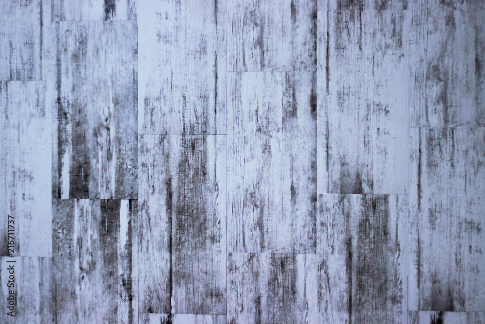 painted with white paint old texture of wooden boards with scuffs ideal for a background and used in interior design.