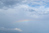 rainbow in the blue sky with clouds after a thunderstorm