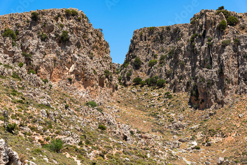Vreiko Cave Pass Lasithi Makrigialos mountains wonderland tour, steep slopes, rocky peaks for hiking adventure recreation sports in Crete, Greece.