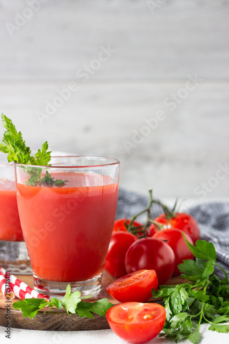 Wallpaper Mural Tomato juice with fresh tomatoes, parsley, sea salt and pepper on light grey background. Vegetable drink. Torontodigital.ca