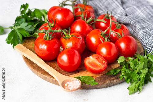 Cherry tomatoes with herbs (parsley), salt and pepper. Organic food. Ingredients for preparation tomato juice or soup (gazpacho).