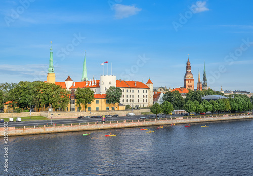 Riga, Latvia - August 23, 2017: Beautiful early morning cityscape of the old town of Riga, St Peter's Church Tower and Daugava river, Latvia. Panorama of old city center and beautiful river, Riga.