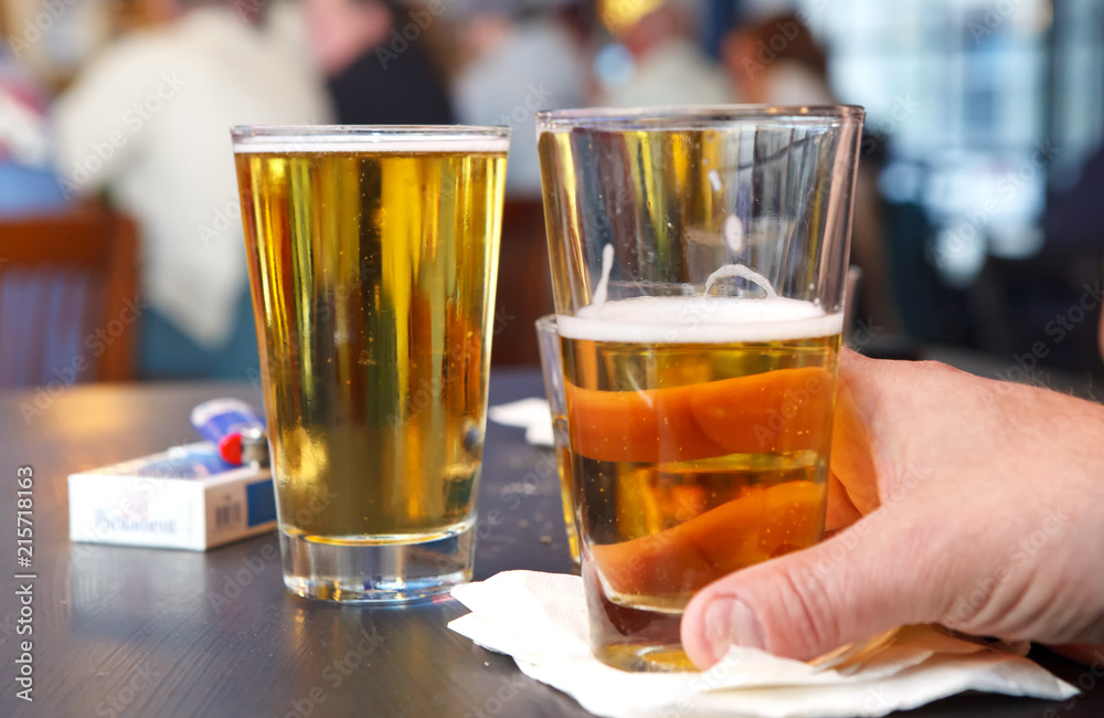Two glasses of beer at a local bar Two glasses of beer at a local bar