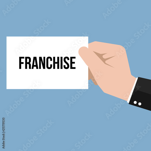 Man showing paper FRANCHISE text 