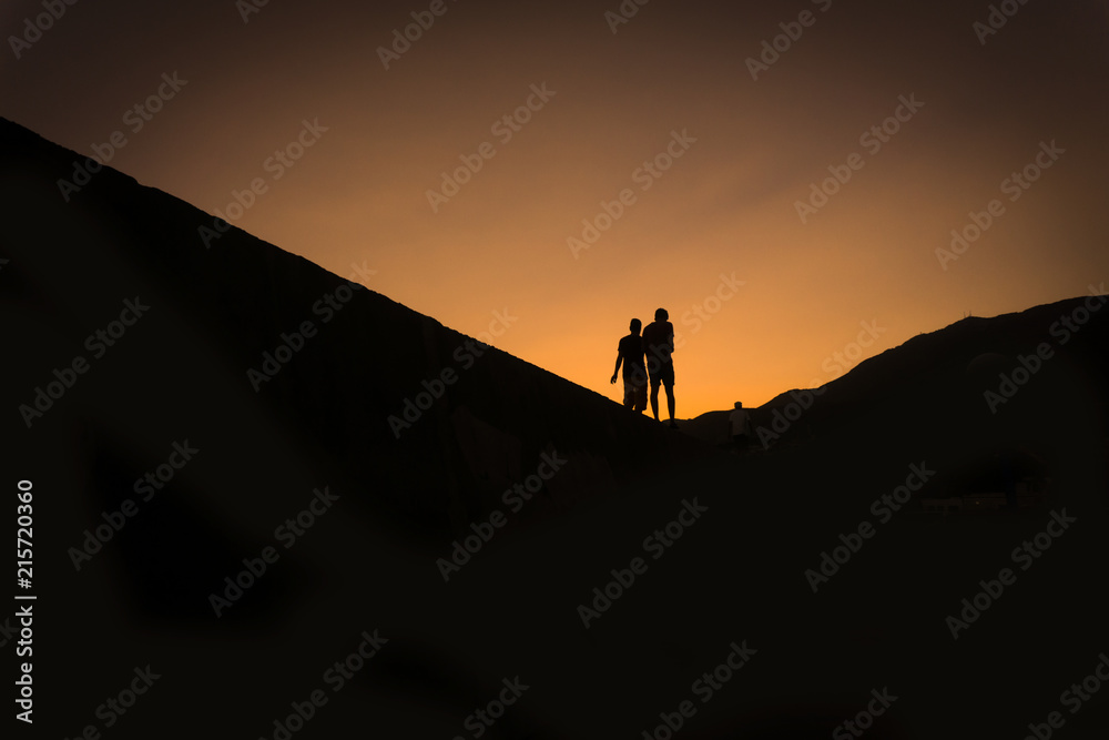 Silhouettes of two people