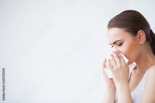 Flu and Sick Woman. Sick Woman Using Paper Tissue, Head Cold Problem photo