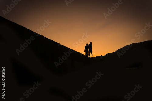 Silhouettes of two people