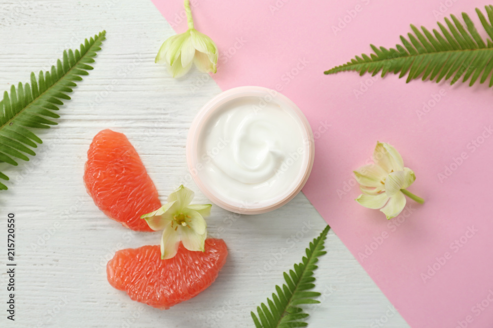 Beautiful composition with jar of cream on colorful background, flat lay Beautiful composition with jar of cream on colorful background, flat lay