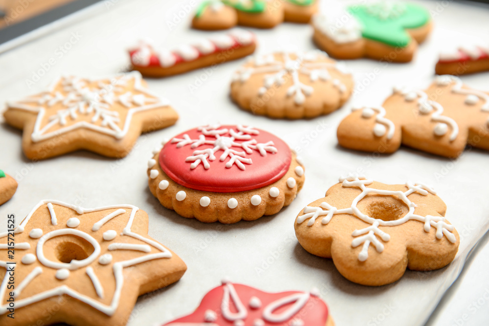 Tasty colorful Christmas cookies on baking tray