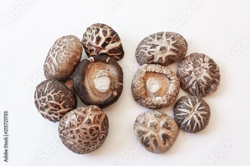 Collection of dried shiitake mushrooms, isolated on white, horizontal aspect