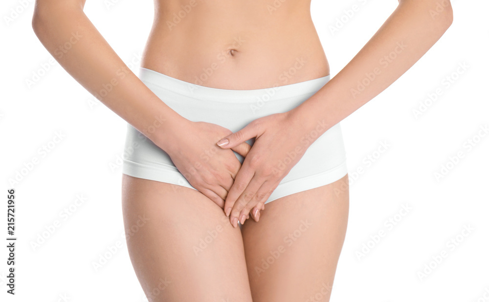 Young woman holding hands near underwear on white background. Gynecology