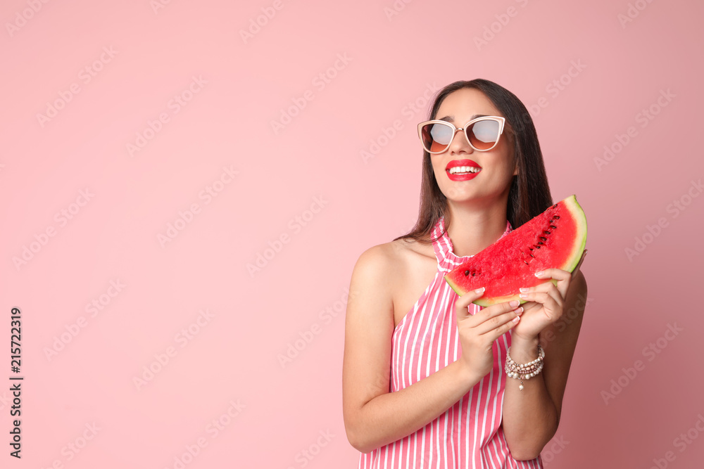Beautiful young woman posing with watermelon on color background Beautiful young woman posing with watermelon on color background