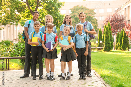 Group of children in stylish school uniform outdoors