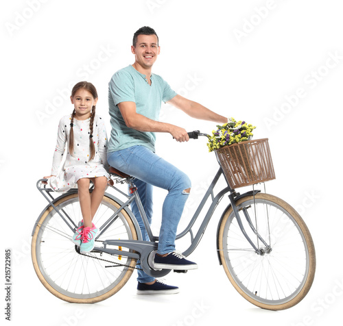 Fototapeta Naklejka Na Ścianę i Meble -  Portrait of father and his daughter with bicycle on white background