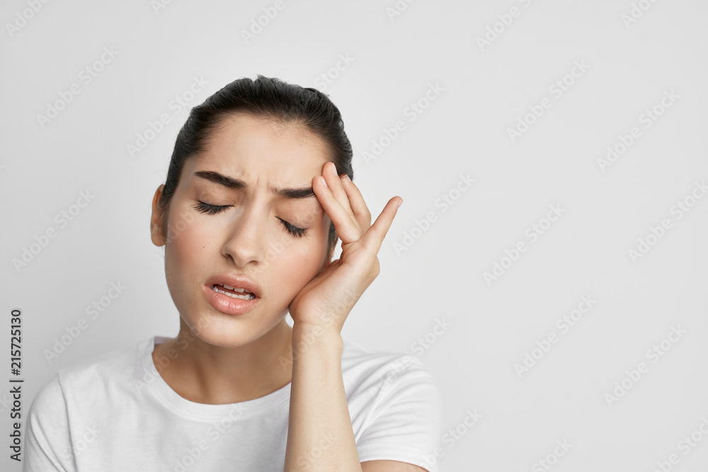 women headache with eyes closed holding head women headache with eyes closed holding head