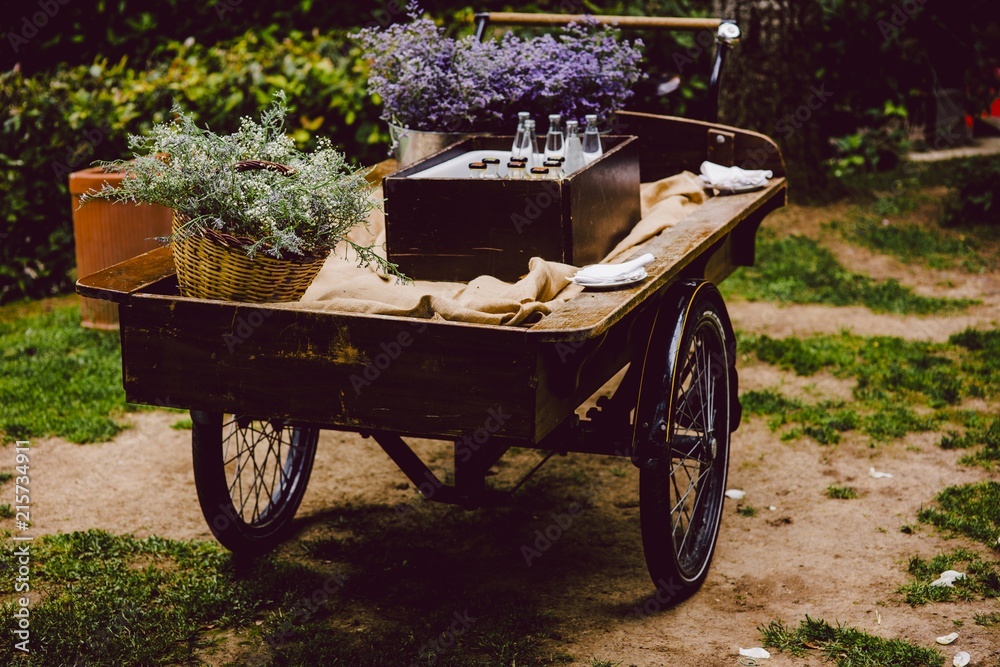 Old wooden cart to transport goods used for decoration at a wedding.