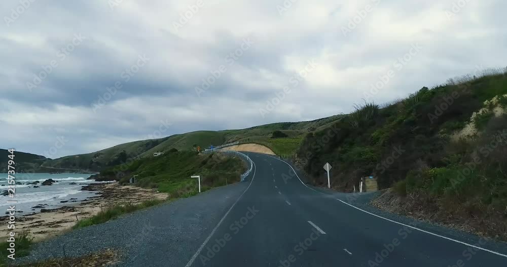 A trip along a winding road through the hills near the shore with rocks. Shevelev. A trip along a winding road through the hills near the shore with rocks. Shevelev.