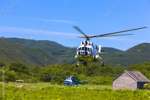 helicopter in the sky at approach photo