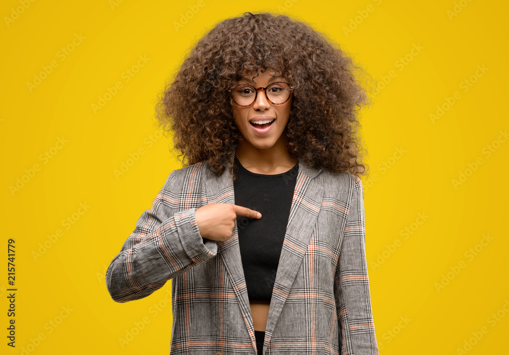 African american woman wearing a jacket with surprise face pointing finger to himself African american woman wearing a jacket with surprise face pointing finger to himself