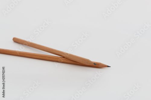 Two Brown pencil with sharp concept ,Isolated on a White Background.