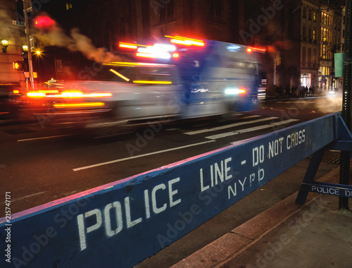 Ambulance at top speed in fifth avenue at night, New York City