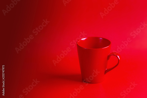 Red coffee cup on a red background